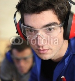 Closeup_of_a_young_worker_wearing_ear_defenders.jpg