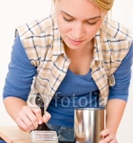 Home_improvement_-_handywoman_painting_wooden_plank.jpg
