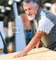 Senior_man_buying_construction_wood_in_a__DIY_store.jpg